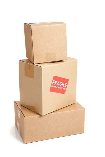 A cardboard moving box with a fragile sticker — Stock Photo, Image