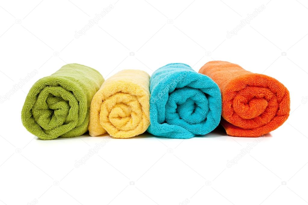 Assorted colored towels on white