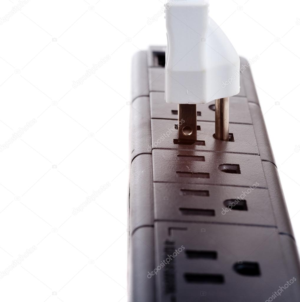 A black power strip with empty outlets