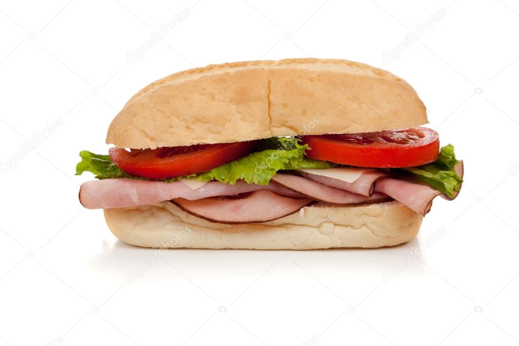 A ham sub sandwich on white