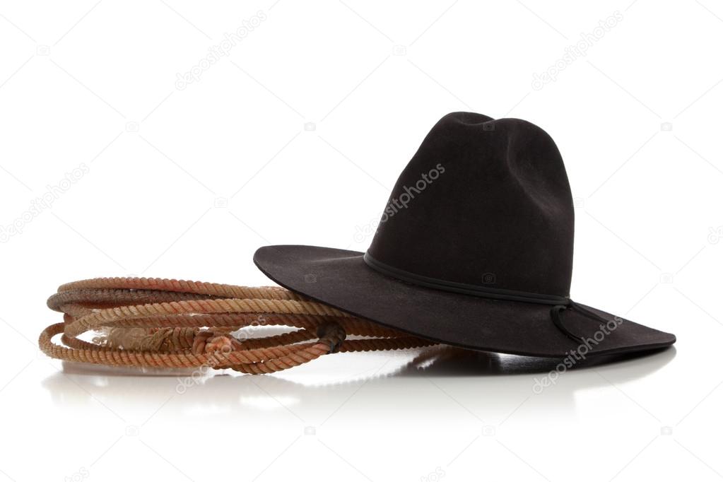 Black cowboy hat with lasso, lariat on white