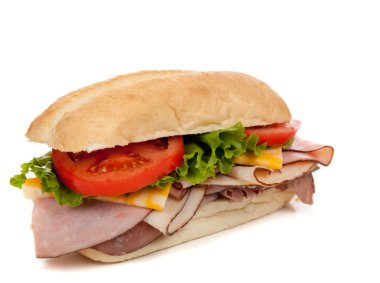 Assorted meat sandwich with fixings on a hoagie clipart