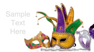 Several mardi gras masks on white with copy space clipart