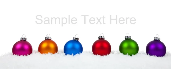Surtido de adornos de Navidad de colores adornos en blanco — Foto de Stock