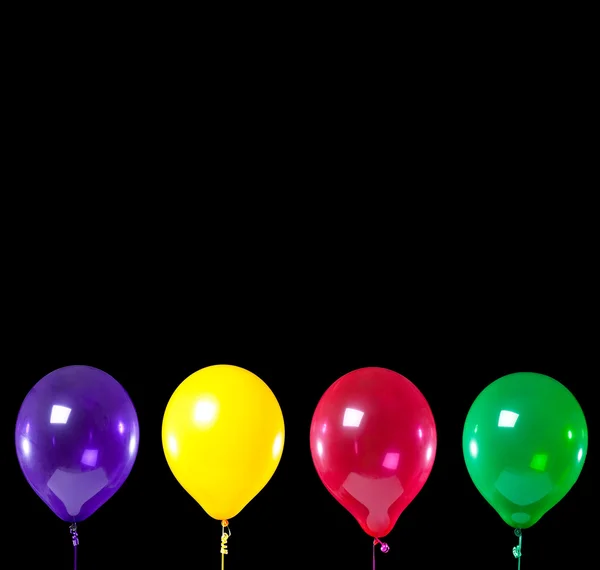 Group of party balloons on black — Stock Photo, Image