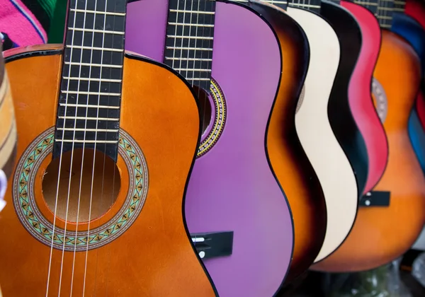 Row of multi-colored mexican guitars — Stock Photo, Image