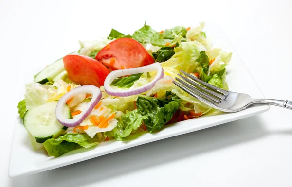 Tossed salad on a plate on a white background — Stock Photo, Image