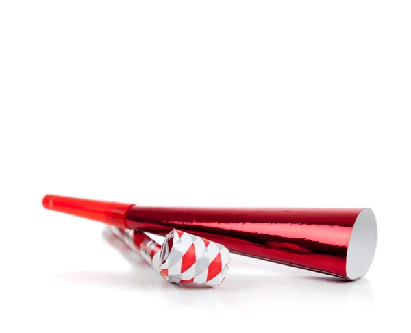 Red and silver noise makers on white — Stock Photo, Image