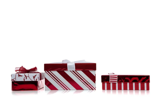 Red and white wrapped Christmas present on white — Stock Photo, Image