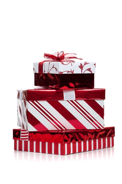 Red and white wrapped Christmas present on white — Stock Photo, Image