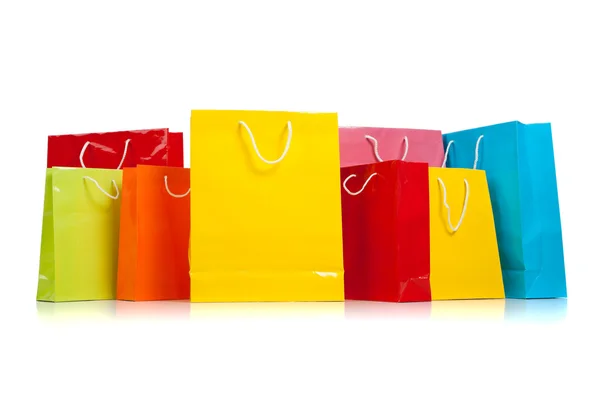Surtido de bolsas de compras de colores en blanco — Foto de Stock