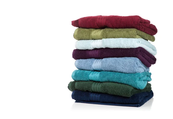 Assorted towels on white with copy space — Stock Photo, Image