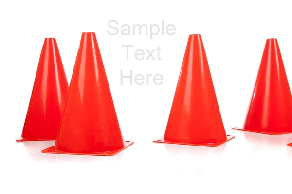 Cones de segurança laranja no branco — Fotografia de Stock