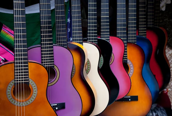 Row of multi-colored Mexican guitars — Stock Photo, Image