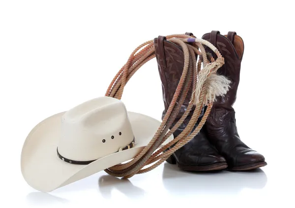 Cowboy hoed, laarzen en lariat op wit — Stockfoto