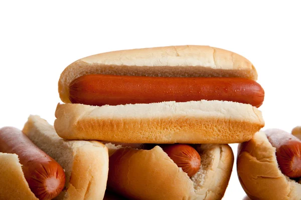 Stacked hot dogs and buns on white — Stock Photo, Image