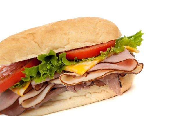 Assorted meat sandwich with fixings on a hoagie — Stock Photo, Image