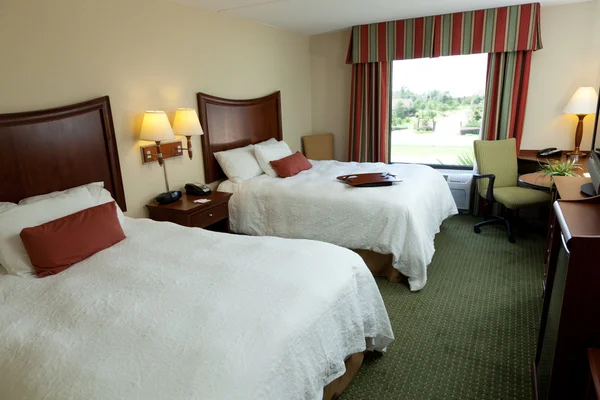 Empty hotel or mtotel room with two beds — Stock Photo, Image