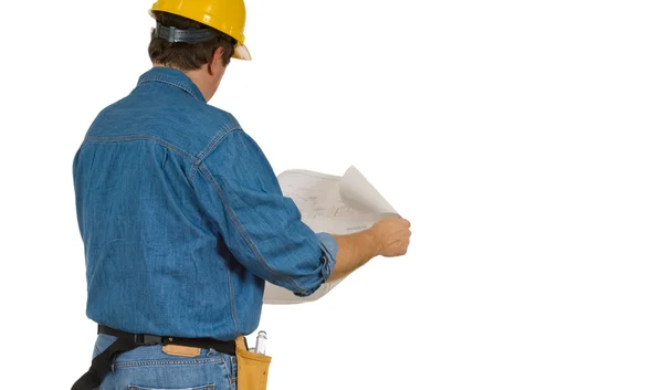 Construction Man reviewing building plans Stock Picture