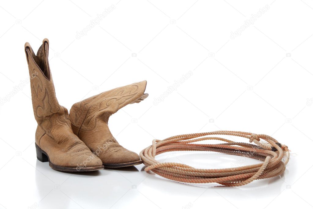 Pair of brown cowboy boots and a lariat rope on white background