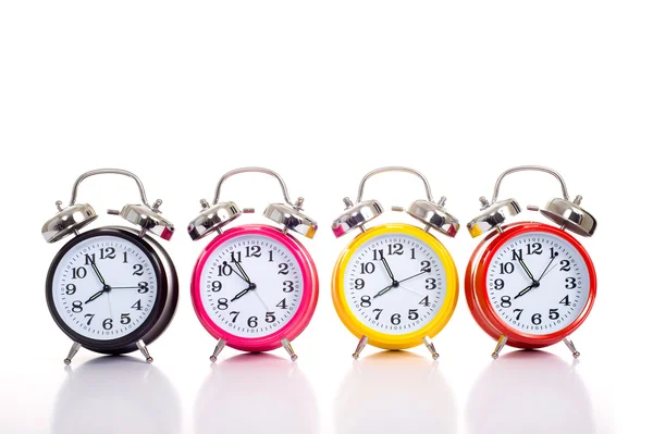 Row Of Alarm Clocks on White — стоковое фото