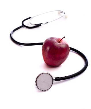 Kırmızı elma ve bir stethescope