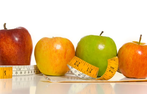 Apples and a tape measure — Stock Photo, Image