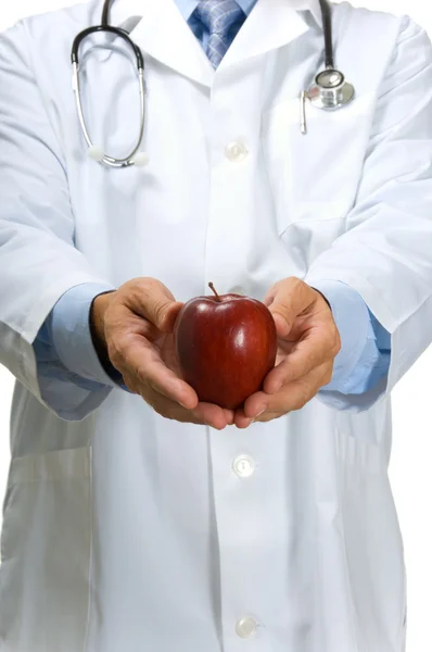 Läkaren erbjuder apple — Stockfoto