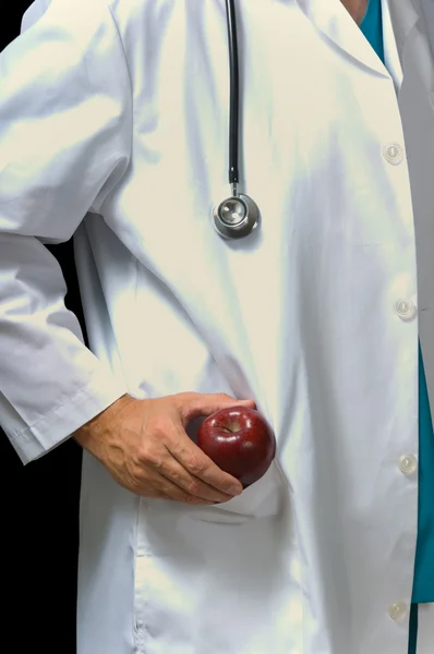 Médico com maçã — Fotografia de Stock