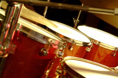 Drum set during performance of music band clipart