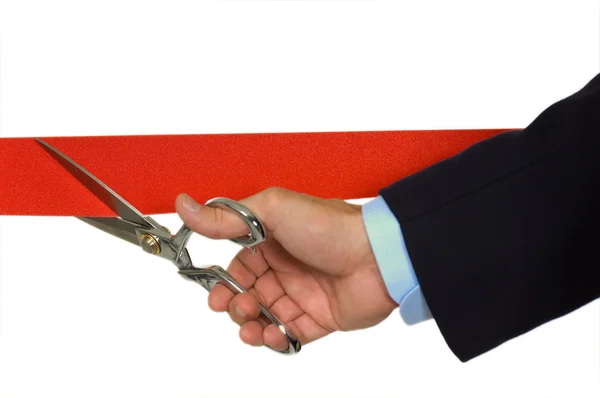 Hand cutting red ribbon — Stock Photo, Image