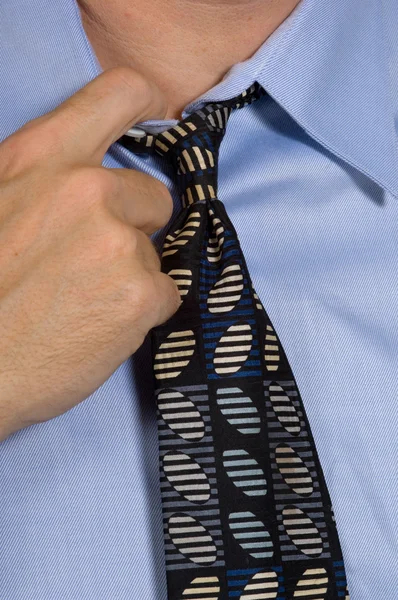 Closeup of business man loosening tie - collar — Stock Photo, Image