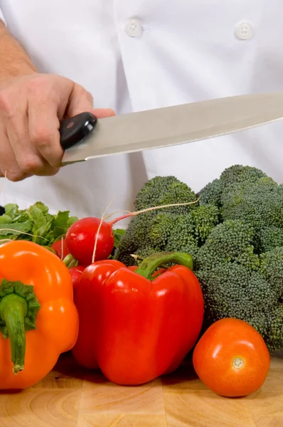 Fresh vegetables on cutting board with knife — Stock Photo, Image