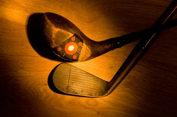 Antique, vintage golf clubs painted with light — Stock Photo, Image