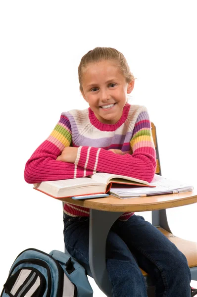 Chica joven en el escritorio en la escuela en blanco —  Fotos de Stock