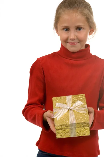 Young girl in red with gold Christmas present — Stock Photo, Image