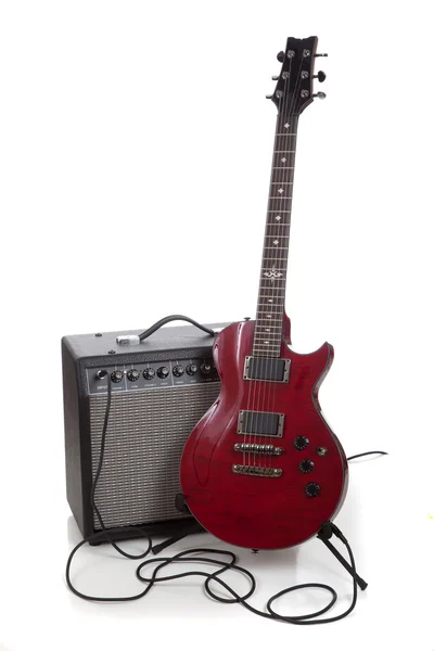 An electric guitar and amp on a white background with copy space — Stock Photo, Image