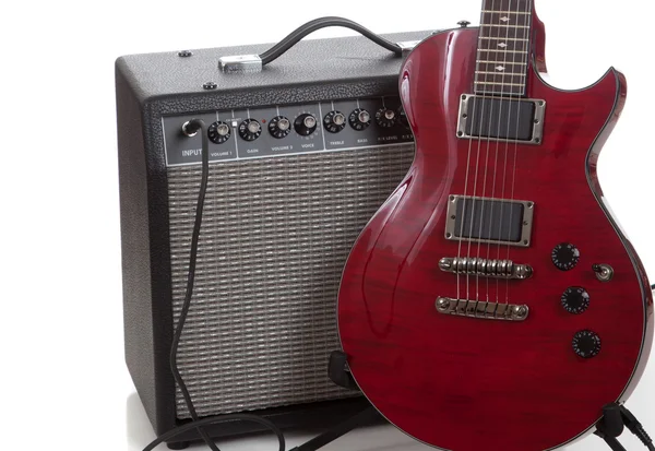 An electric guitar with a black amp on a white background — Stock Photo, Image