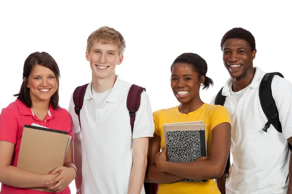 Multietniska college studenter/vänner med ryggsäckar och böcker o — Stockfoto