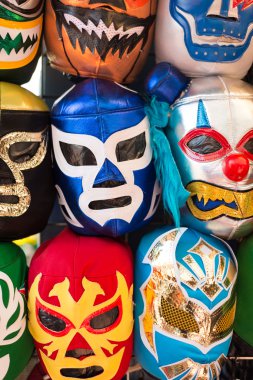Arrangement of various luchador masks as a background clipart
