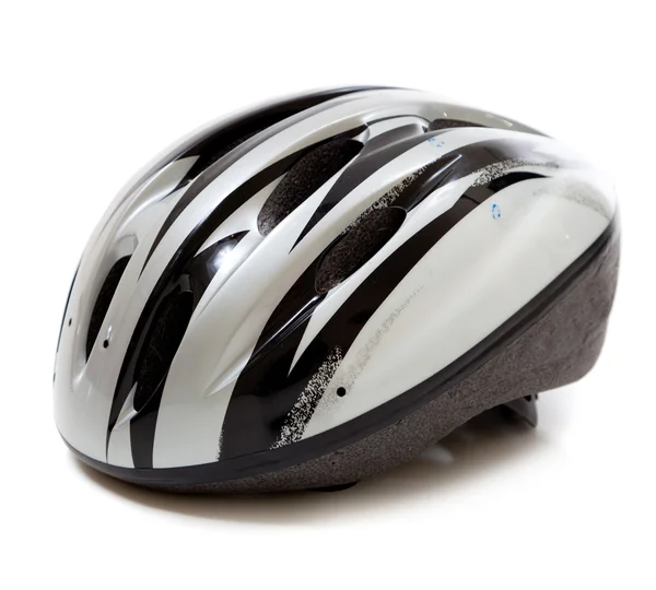 Um capacete de bicicleta cinza em um fundo branco — Fotografia de Stock