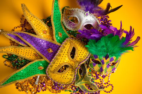 Colorful group of Mardi Gras or venetian mask or costumes on a y — Stock Photo, Image