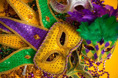 Colorful group of Mardi Gras or venetian mask or costumes on a y clipart