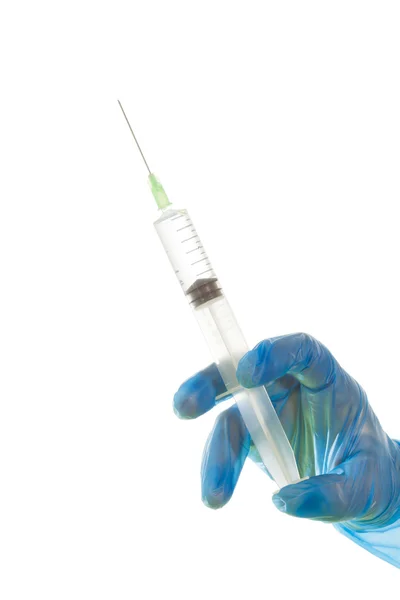 Hand in glove with medical syringe — Stock Photo, Image