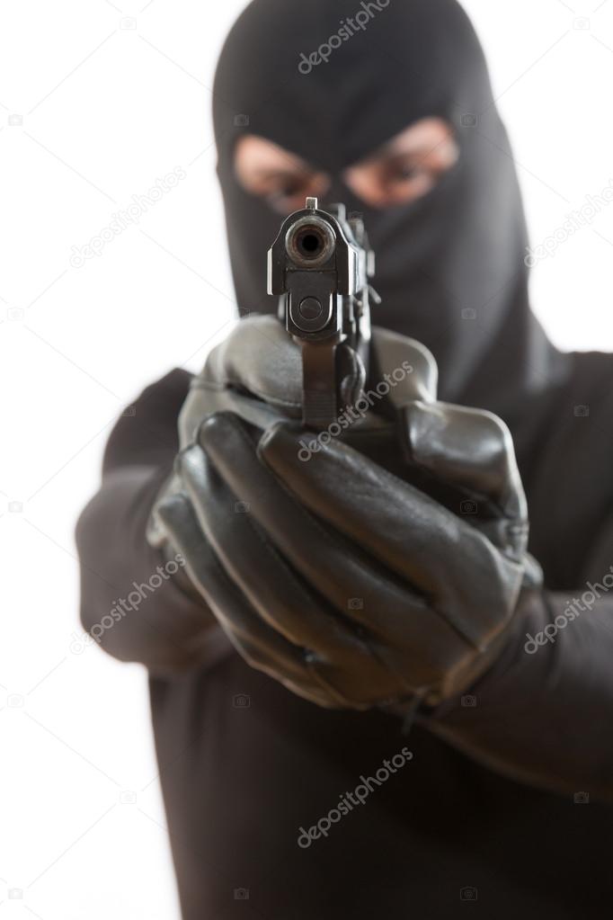 Thief pointing a gun