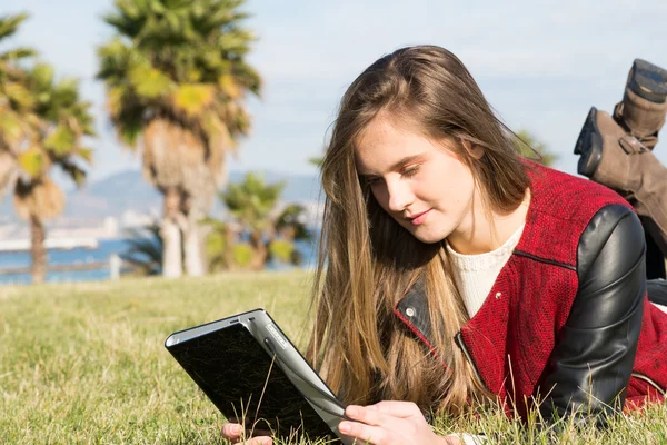 Young Girl with a tablet — Stock Photo, Image