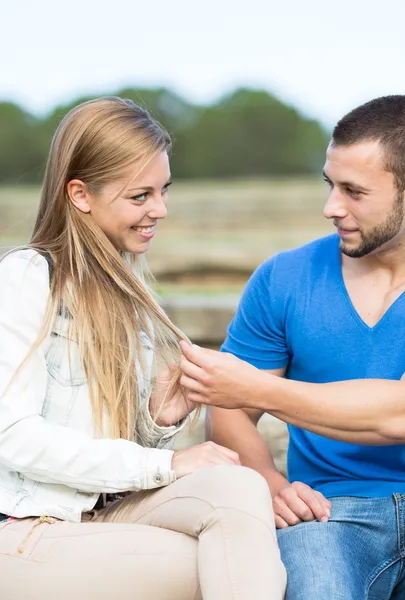 Man stroking the hair of his girl — Stock Photo, Image