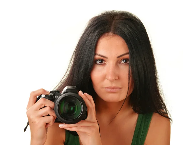 Young woman holding a camera isolated on white — Stock Photo, Image