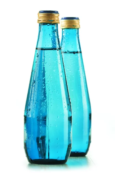 Glass bottle of mineral water isolated on white — Stock Photo, Image