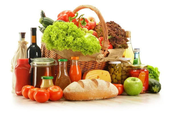 Composition with grocery products in shopping basket — Stock Photo, Image